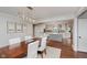 Open concept dining room featuring hardwood floors and access to a modern kitchen at 246 Westchester Blvd, Noblesville, IN 46062