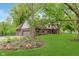 Beautiful exterior view showcasing a manicured lawn, tasteful landscaping, and three-car garage at 246 Westchester Blvd, Noblesville, IN 46062