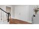 Lovely home foyer featuring hardwood floors and staircase with black railing at 246 Westchester Blvd, Noblesville, IN 46062