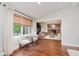 Bright recreation room with table, wood floors, and view into living space at 246 Westchester Blvd, Noblesville, IN 46062