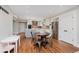 Open kitchen and dining area with stainless steel appliances, white cabinets, gray island, and seating at 246 Westchester Blvd, Noblesville, IN 46062