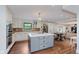 Spacious kitchen showcases white cabinets, stainless appliances, modern island with marble countertop and a dining area at 246 Westchester Blvd, Noblesville, IN 46062