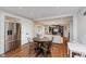 Open-concept living room, stainless steel refrigerator, and dining area offering seamless flow and modern living at 246 Westchester Blvd, Noblesville, IN 46062