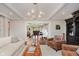 Elegant living room with coffered ceilings, fireplace, and open view to the modern bar and seating area at 246 Westchester Blvd, Noblesville, IN 46062