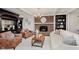 Stylish living room featuring a brick fireplace, modern decor, and comfortable seating for a cozy ambiance at 246 Westchester Blvd, Noblesville, IN 46062