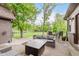 Relaxing backyard patio offers comfortable seating, a modern fire pit, and a view of the beautiful green lawn at 246 Westchester Blvd, Noblesville, IN 46062