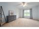 Comfortable bedroom with light blue walls, carpet flooring, a ceiling fan, and bright window at 2717 W Long Meadow Ln, Muncie, IN 47304