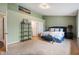 Spacious bedroom with neutral carpet, an upholstered headboard, and ample natural light at 2717 W Long Meadow Ln, Muncie, IN 47304