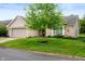 Charming single-Gathering home featuring a brick facade, attached garage, and well-manicured lawn at 2717 W Long Meadow Ln, Muncie, IN 47304
