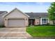 Charming single-Gathering home featuring a brick facade, attached garage, and well-manicured lawn at 2717 W Long Meadow Ln, Muncie, IN 47304