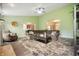 Comfortable living room showcasing a large sectional, ceiling fan, and archways to the kitchen and foyer at 2717 W Long Meadow Ln, Muncie, IN 47304