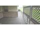 Spacious back porch with wood floors, offering a comfortable outdoor retreat at 3107 N 100 W, Shelbyville, IN 46176