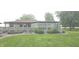 Beautifully landscaped backyard with a spacious deck and well-manicured lawn at 3107 N 100 W, Shelbyville, IN 46176