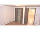 This basement features modern doors, neutral wallpaper, and an accessible closet at 3107 N 100 W, Shelbyville, IN 46176