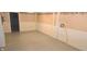 A spacious basement featuring painted floors and paneled walls with wainscotting at 3107 N 100 W, Shelbyville, IN 46176