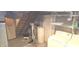 Unfinished basement with sump pump, water softener, laundry area, and exposed staircase at 3107 N 100 W, Shelbyville, IN 46176