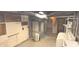 Unfinished basement featuring exposed ductwork, utility connections, and laundry sink at 3107 N 100 W, Shelbyville, IN 46176