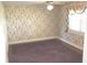 Cozy bedroom with floral wallpaper, carpeted floor, and bright window at 3107 N 100 W, Shelbyville, IN 46176