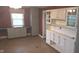 Dining room with gray built-in cabinets, neutral walls, and neutral tile flooring at 3107 N 100 W, Shelbyville, IN 46176