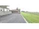 A view of the exterior of the home and the driveway at 3107 N 100 W, Shelbyville, IN 46176