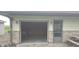 An open garage door provides a view of the interior at 3107 N 100 W, Shelbyville, IN 46176
