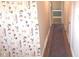 Hallway with hardwood floors and floral wallpaper detail, leading to other rooms at 3107 N 100 W, Shelbyville, IN 46176