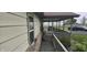 Covered porch with lattice and lush landscaping for added privacy at 3107 N 100 W, Shelbyville, IN 46176