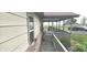 Inviting side porch with lush landscaping and ample space, great for relaxing outdoors at 3107 N 100 W, Shelbyville, IN 46176