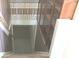The stairwell features striped and floral wallpaper and hardwood stairs at 3107 N 100 W, Shelbyville, IN 46176