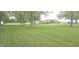 Lush green yard surrounds a charming home with an inviting, large deck at 3107 N 100 W, Shelbyville, IN 46176