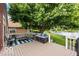 Relaxing back deck with comfortable seating, a striped rug, and serene views of the lake at 3403 Island Way, Indianapolis, IN 46214