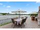 Spacious deck with waterfront views, dining area, and outdoor bar for entertaining at 3403 Island Way, Indianapolis, IN 46214