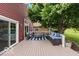 Relaxing back deck with comfortable seating, a striped rug, and serene views of the lake at 3403 Island Way, Indianapolis, IN 46214