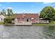 Waterfront home with a spacious deck for outdoor entertaining and enjoying scenic views at 3403 Island Way, Indianapolis, IN 46214