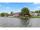 The back of the house has a large yard with a pier and easy access to the lake at 3403 Island Way, Indianapolis, IN 46214