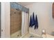 Bathroom showcasing tiled shower, neutral color scheme, and decorative towels at 3403 Island Way, Indianapolis, IN 46214