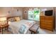Guest bedroom featuring nautical décor, a comfortable bed, and ample natural light at 3403 Island Way, Indianapolis, IN 46214