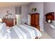 Comfortable bedroom with wood furnishings, nautical decor, and ensuite bathroom access at 3403 Island Way, Indianapolis, IN 46214