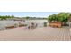Spacious wooden deck featuring a boat dock, outdoor seating, and a relaxing hot tub area with scenic lake views at 3403 Island Way, Indianapolis, IN 46214