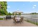 Deck with outdoor dining set, grill, and lake view at 3403 Island Way, Indianapolis, IN 46214