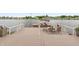 Wooden deck with pontoon boat, outdoor dining, and stunning lake view at 3403 Island Way, Indianapolis, IN 46214