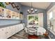 Inviting dining area with lake view, stylish lighting, and charming decor at 3403 Island Way, Indianapolis, IN 46214