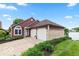 Inviting red-sided house with a two-car garage and well-maintained landscaping near a picturesque lake at 3403 Island Way, Indianapolis, IN 46214