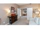 An open floorplan reveals a sophisticated living space with an adjacent bar area, seamlessly connecting to the next room at 3403 Island Way, Indianapolis, IN 46214