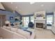 Inviting living room featuring vaulted ceilings, a fireplace, and seamless transition to nearby rooms at 3403 Island Way, Indianapolis, IN 46214