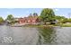 Waterfront home with large deck and boat dock offering stunning views of the lake at 3403 Island Way, Indianapolis, IN 46214