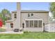 View of a backyard featuring a screened in porch, deck, furniture, storage shed and an expansive lawn at 3803 Churchman Woods Blvd, Indianapolis, IN 46203