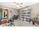 Bedroom with neutral colored walls, ceiling fan, carpet, storage shelves and access to a hallway at 3803 Churchman Woods Blvd, Indianapolis, IN 46203