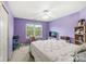 Bright bedroom with a large window and a full-sized bed at 3803 Churchman Woods Blvd, Indianapolis, IN 46203