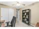 Office/bedroom with neutral paint, dark wood shelves, large windows and a ceiling fan at 3803 Churchman Woods Blvd, Indianapolis, IN 46203